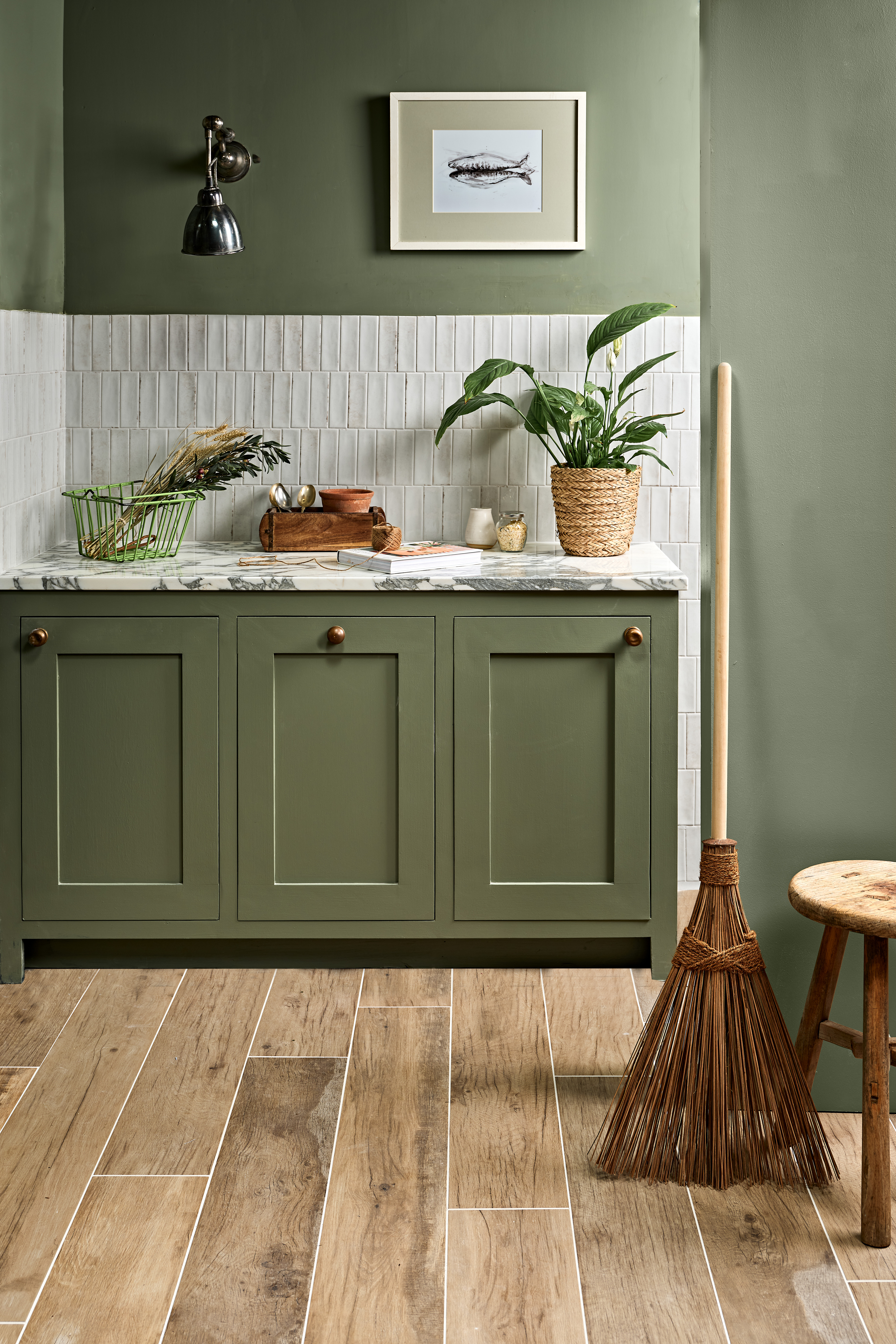 Painted green traditional kitchen in shaker style with natural and white gloss tiles. Bespoke Kitchens