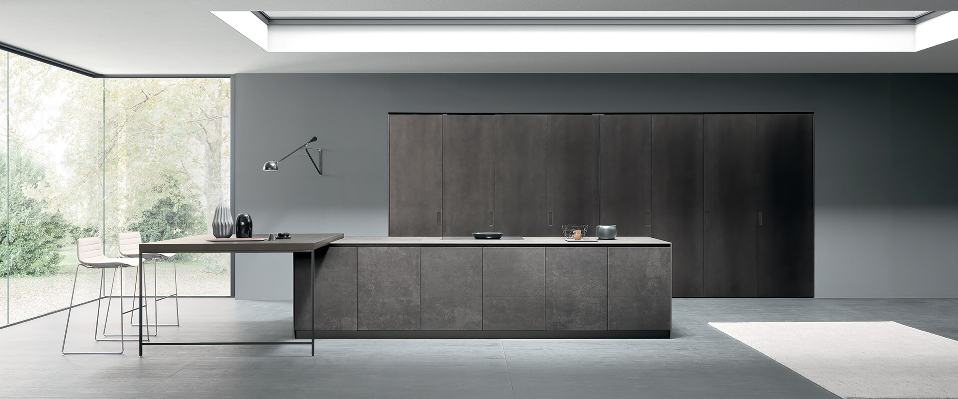 Metal finish doors with pocket doors and breakfast bar island | IN Design Kitchens and Living Spaces 